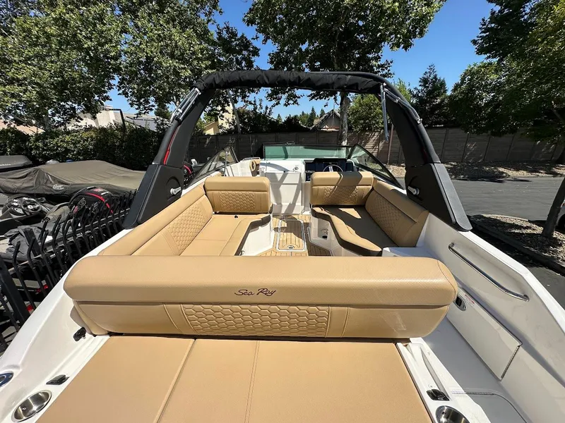 Slide: The Image of 2024 Sea Ray SDX 250 boat with tan leather seating and spacious deck. - 38