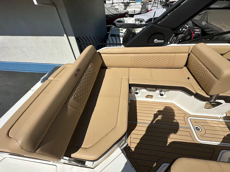 Slide: The Image of 2024 Sea Ray SDX 250 boat with tan leather seating and teak flooring. - 40