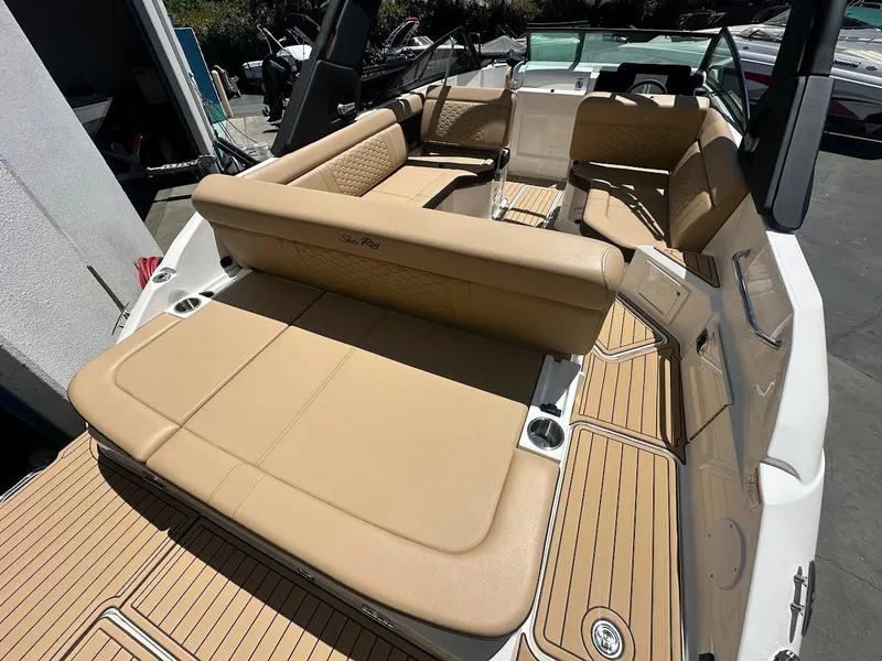 Slide: The Image of 2024 Sea Ray SDX 250 boat with tan leather seating and spacious deck. - 43