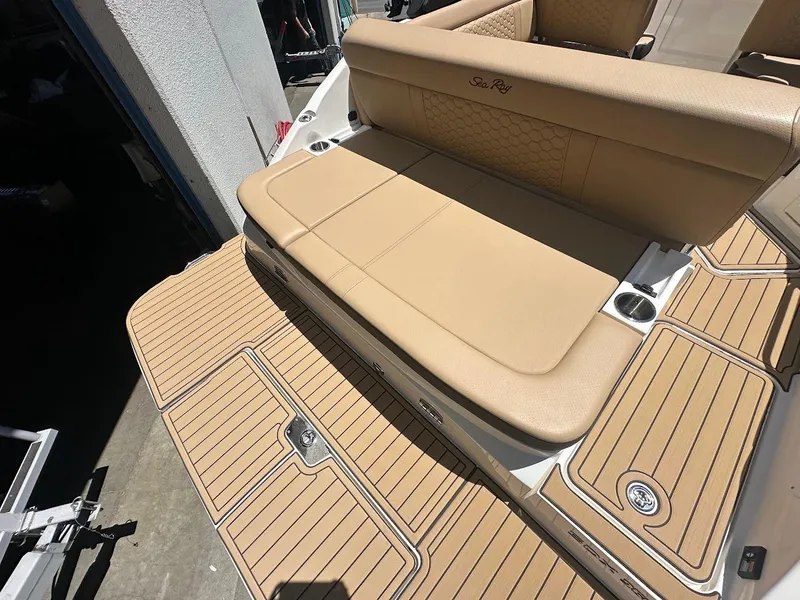 Slide: The Image of 2024 Sea Ray SDX 250 boat with tan seating and deck. - 45