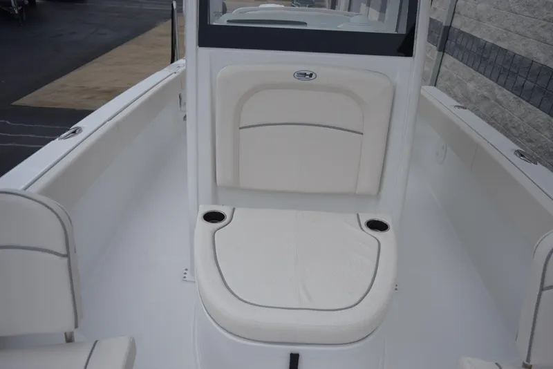 Slide: The Image of 2024 Sea Hunt Escape 27 boat interior seating area with cup holders. - 15