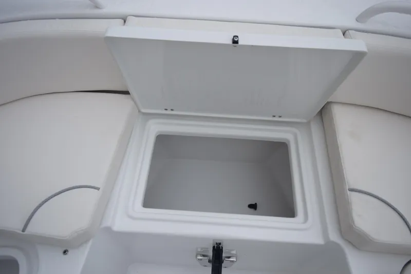 Slide: The Image of 2024 Sea Hunt Escape 27 boat storage compartment with open lid. - 18