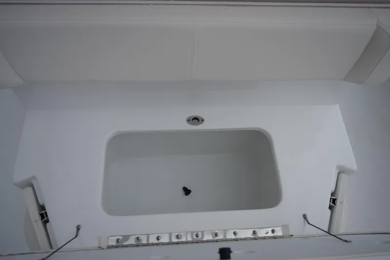 Slide: The Image of 2024 Sea Hunt Escape 27 boat interior storage compartment. - 23