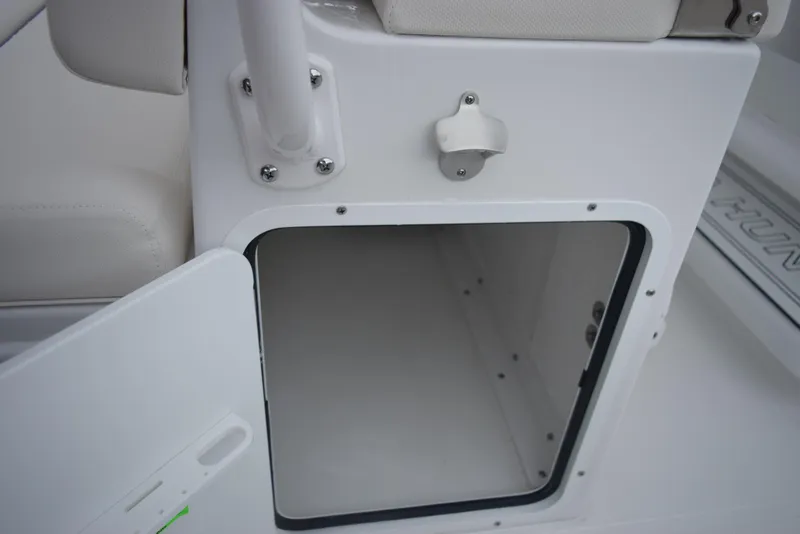 Slide: The Image of Open storage compartment on a 2024 Sea Hunt Escape 27 boat. - 28