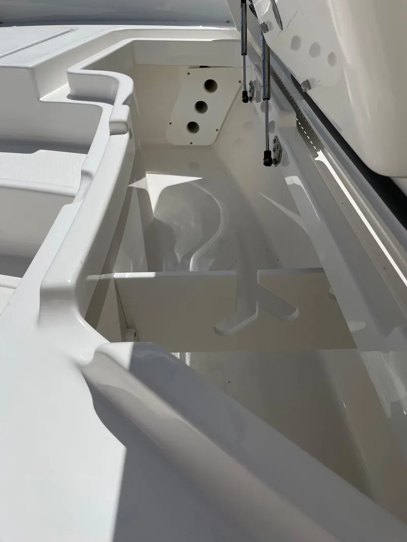 Slide: The Image of 2024 Regulator 24XO boat interior storage compartment. - 12
