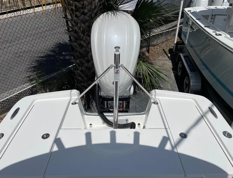 Slide: The Image of 2024 Regulator 24XO boat stern with outboard motor. - 14