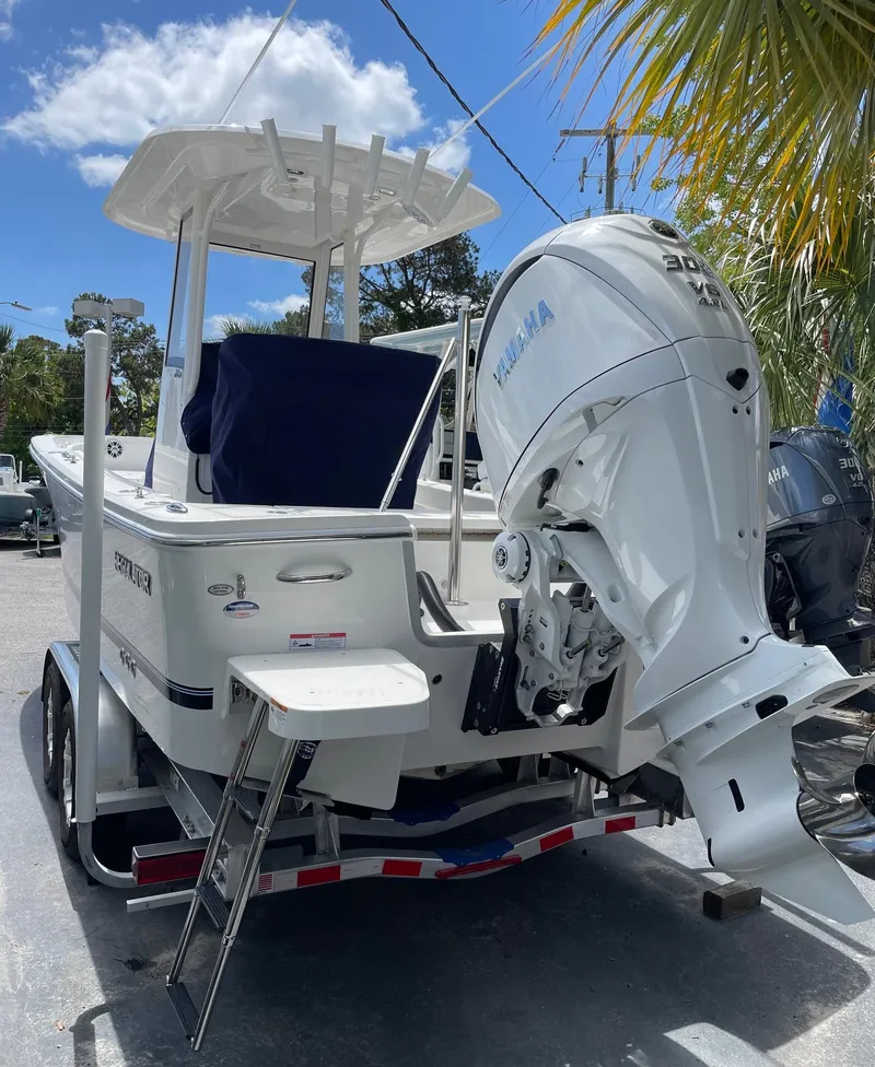 Slide: The Image of 2024 Regulator 24XO boat on trailer with Yamaha outboard motor. - 2