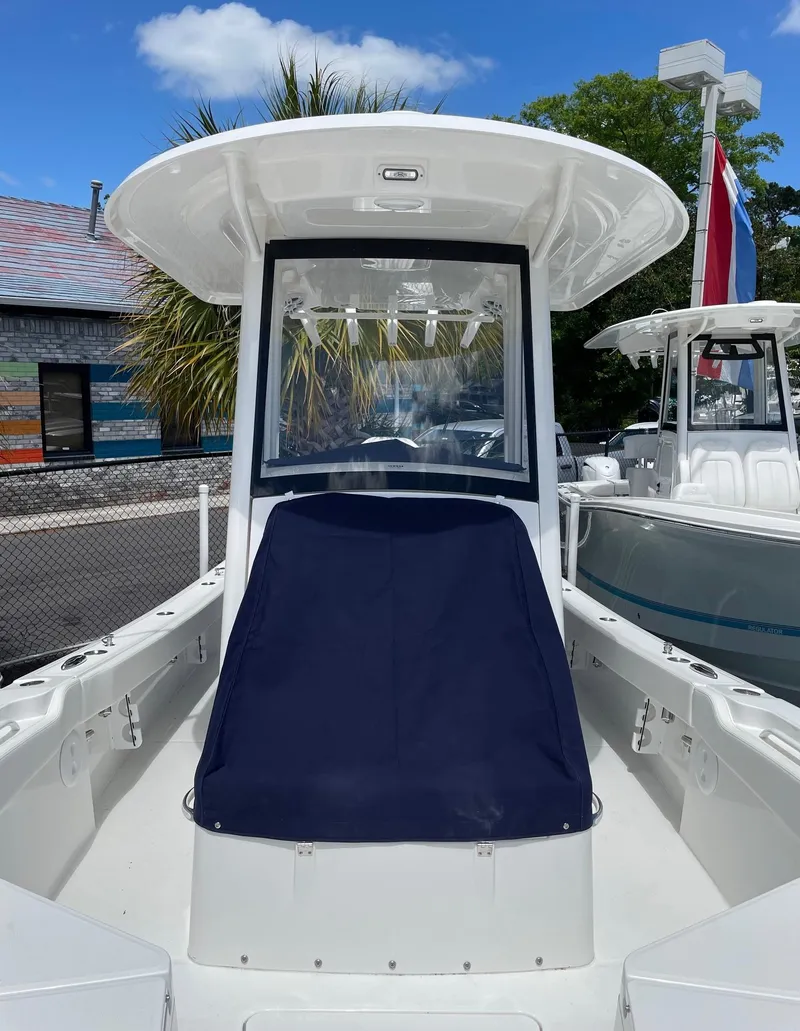 Slide: The Image of 2024 Regulator 24XO boat with T-top and covered console. - 20