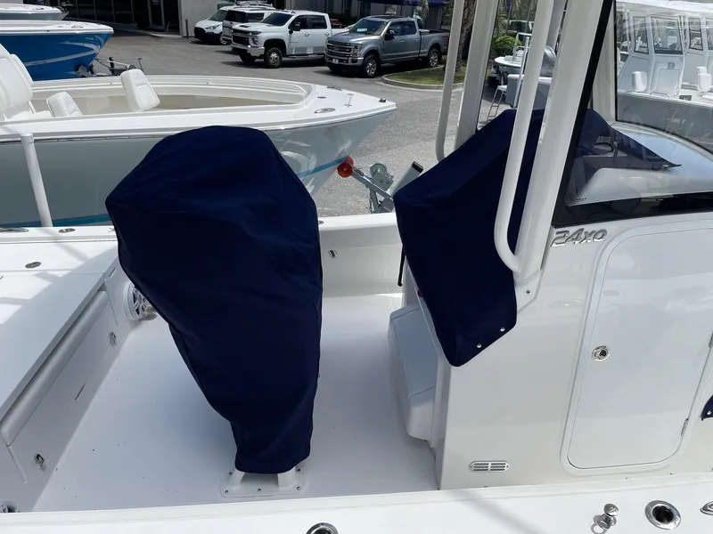 Slide: The Image of 2024 Regulator 24XO boat with covered seats and console. - 21