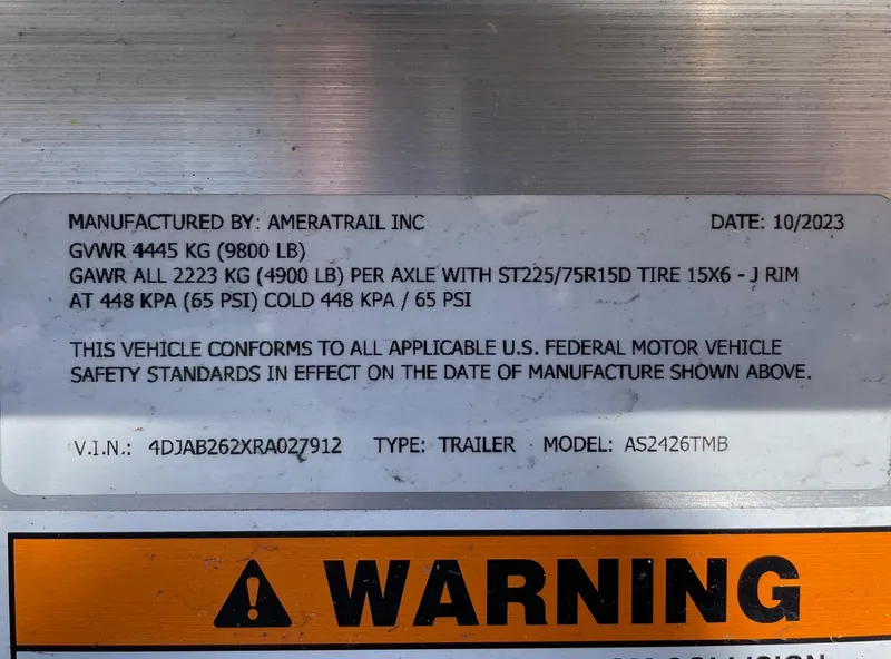 Slide: The Image of 2024 Regulator 24XO trailer label with specifications and warning sign. - 29