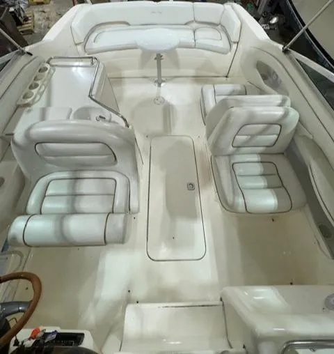 Slide: The Image of 1997 Sea Ray 280 boat interior with white leather seating and spacious layout. - 15