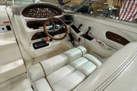 Slide: The Image of 1997 Sea Ray 280 boat interior with steering wheel and control panel. - 24
