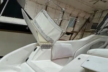 Slide: The Image of 1997 Sea Ray 280 boat interior with open storage compartment. - 35