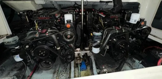 Slide: The Image of 1997 Sea Ray 280 boat engine compartment with twin engines. - 36
