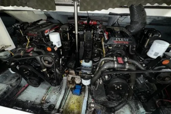 Slide: The Image of 1997 Sea Ray 280 engine compartment with twin MerCruiser 5.7L V8 engines. - 39