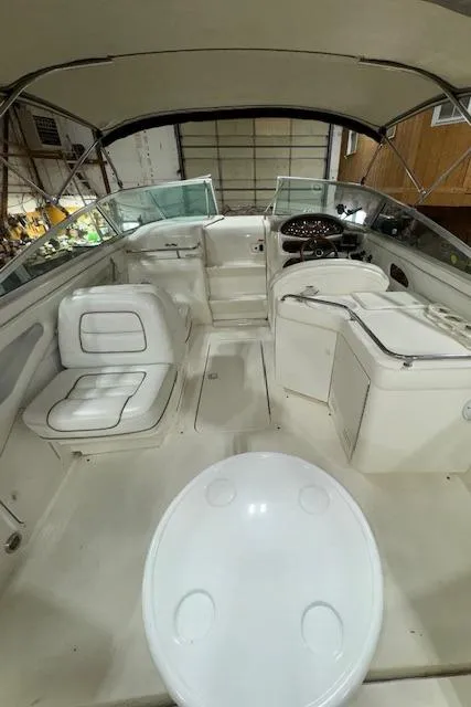 Slide: The Image of 1997 Sea Ray 280 boat interior with seating and helm station. - 4