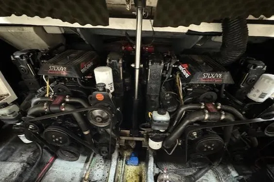 Slide: The Image of Twin engines of a 1997 Sea Ray 280 boat in the engine compartment. - 41