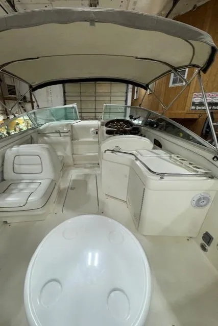 Slide: The Image of 1997 Sea Ray 280 boat interior with seating and helm station. - 6