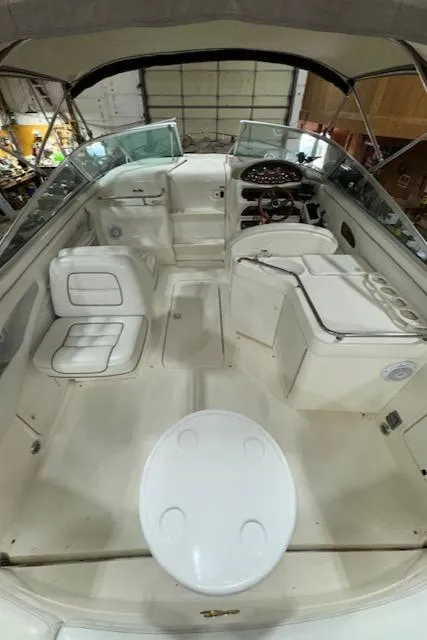 Slide: The Image of 1997 Sea Ray 280 boat interior with seating and helm. - 9