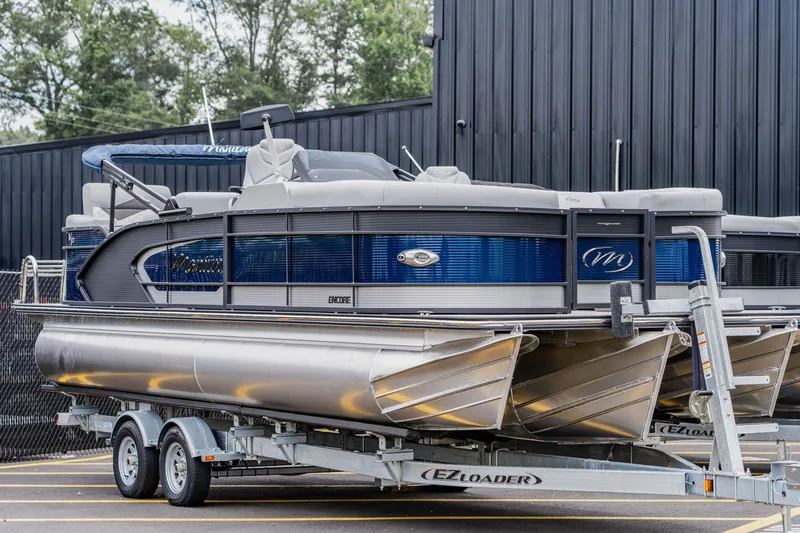 Slide: The Image of 2022 Manitou 23 Encore pontoon boat on trailer. - 3