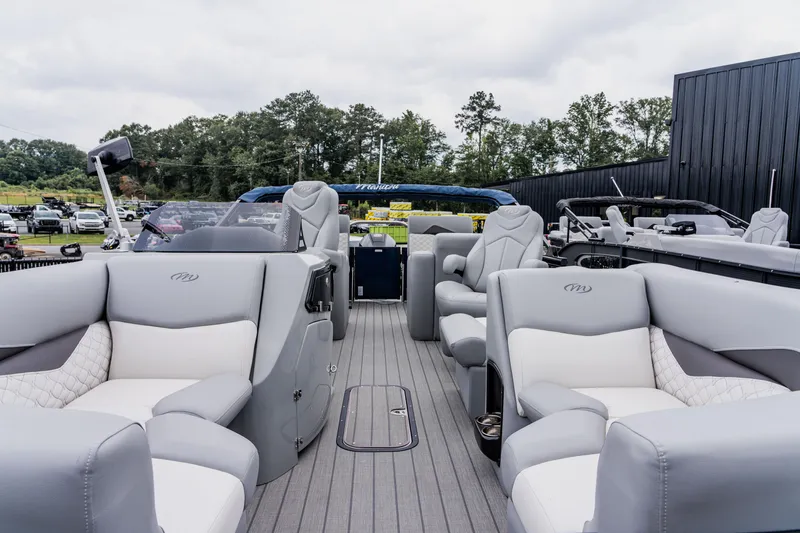 Slide: The Image of 2022 Manitou 23 Encore pontoon boat with luxurious seating and modern design. - 5