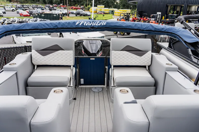 Slide: The Image of 2022 Manitou 23 Encore pontoon boat with luxurious seating and modern design. - 7