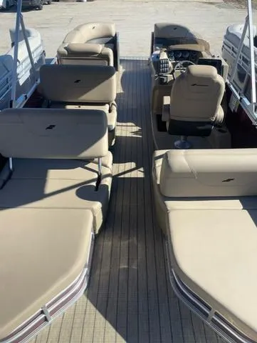 Slide: The Image of 2023 Starcraft CX 25 RL Tritoon with 300 Mercury DTS, featuring spacious seating and modern design. - 4