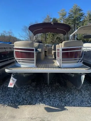 Slide: The Image of 2023 Starcraft CX 25 RL Tritoon with 300 Mercury DTS, rear view, docked outdoors. - 5