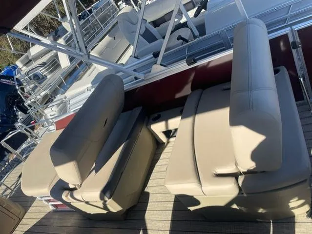 Slide: The Image of 2023 Starcraft CX 25 RL Tritoon with beige seating and 300 Mercury DTS engine. - 6