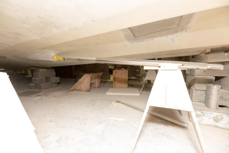 Slide: The Image of Custom Carolina 63 (2024) boat under construction in a workshop. - 10