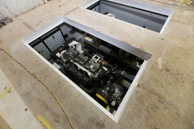 Slide: The Image of Engine compartment of a 2024 Custom Carolina 63 boat under construction. - 14