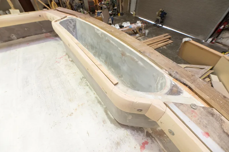 Slide: The Image of Custom Carolina 63 boat under construction, 2024 model, interior view of unfinished deck. - 17