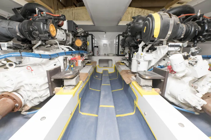 Slide: The Image of Engine room of a 2024 Custom Carolina 63 yacht with dual engines. - 22