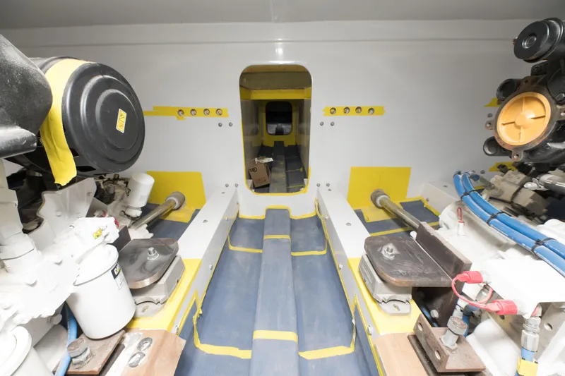 Slide: The Image of Engine room of a 2024 Custom Carolina 63 boat with visible machinery. - 30