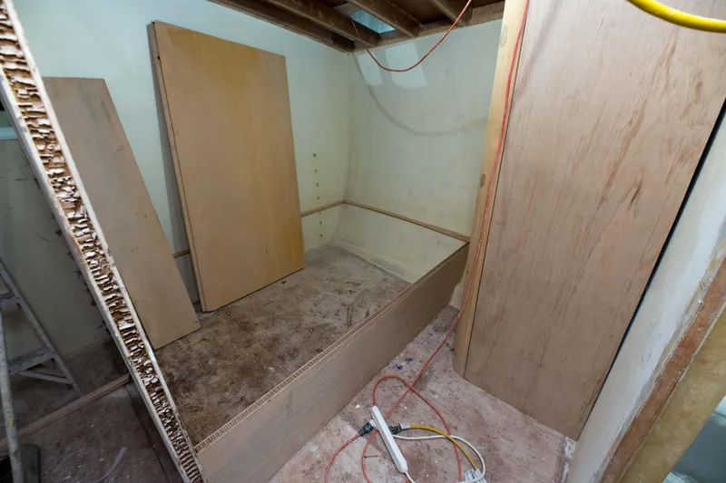 Slide: The Image of 2024 Custom Carolina 63 boat under construction, interior cabin view. - 39