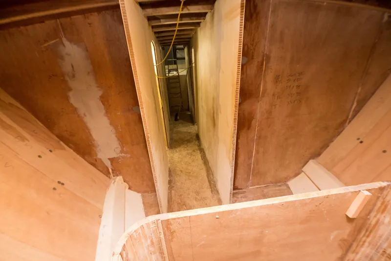 Slide: The Image of Interior construction of 2024 Custom Carolina 63 boat in progress. - 44