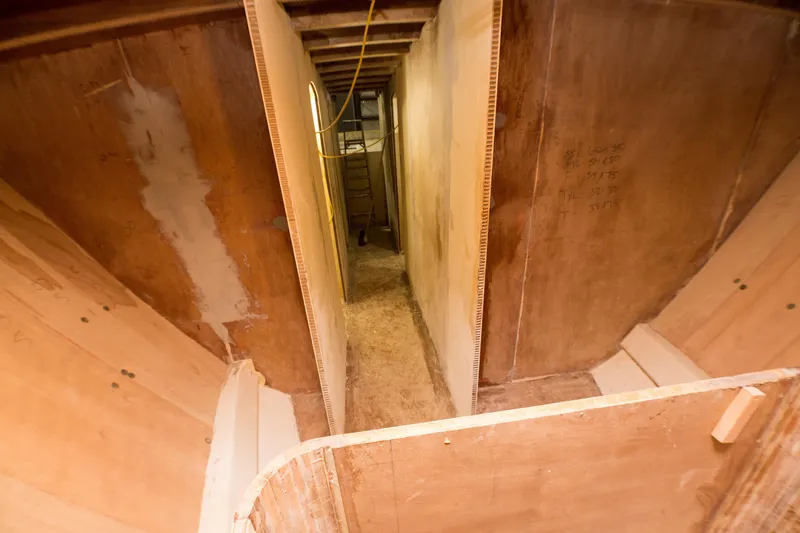 Slide: The Image of Interior construction of 2024 Custom Carolina 63 boat in progress. - 45