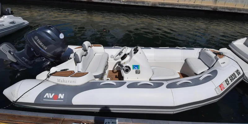 Slide: The Image of 2017 Avon Seasport 400DL boat docked with Yamaha outboard motor. - 9