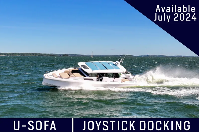 Slide: The Image of 2024 Axopar 45 boat cruising on water, featuring U-Sofa and joystick docking, available July 2024. - 0