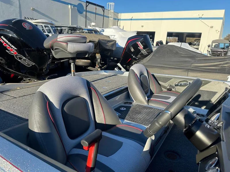 Slide: The Image of 2024 Ranger Z518 boat interior with dual seats and steering wheel. - 6