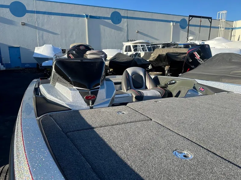 Slide: The Image of 2024 Ranger Z518 boat in storage, featuring sleek design and covered seats. - 9