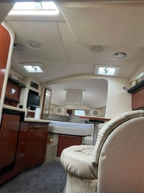 Slide: The Image of Interior of 2002 Sea Ray 340 Sundancer yacht with modern amenities. - 10