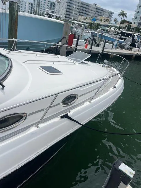 Slide: The Image of 2002 Sea Ray 340 Sundancer docked at a marina. - 11