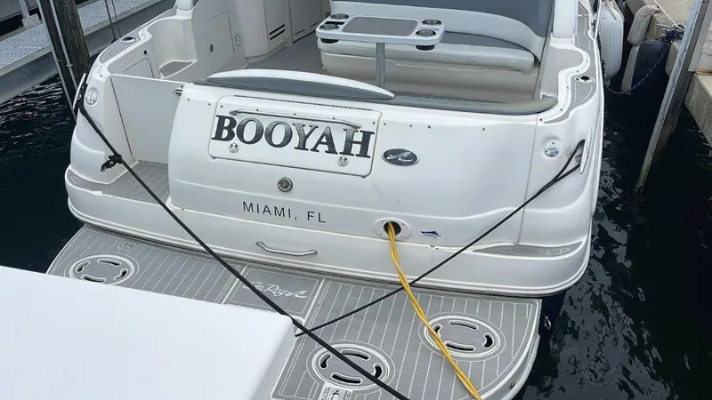 Slide: The Image of Sea Ray 340 Sundancer 2002 boat docked in Miami, FL with BOOYAH nameplate. - 12