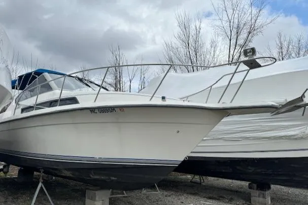 Slide: The Image of 1993 Carver 280 Express boat on dry dock, side view. - 6