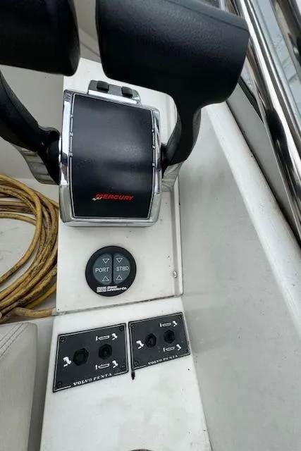 Slide: The Image of Close-up of 1993 Carver 280 Express boat controls and throttle. - 14