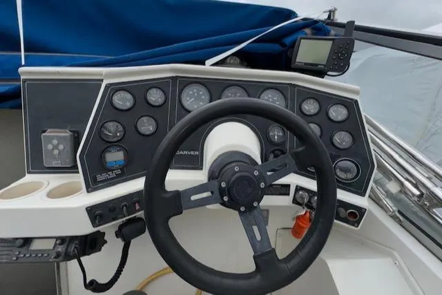 Slide: The Image of 1993 Carver 280 Express boat dashboard with steering wheel and instrument panel. - 22