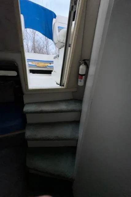 Slide: The Image of Interior stairs of a 1993 Carver 280 Express boat. - 23