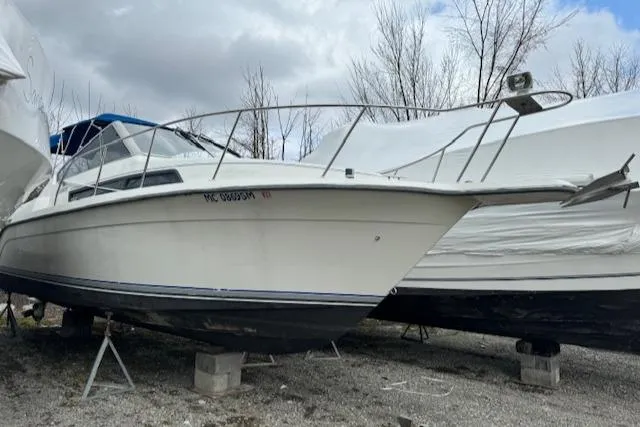 Slide: The Image of 1993 Carver 280 Express boat on dry dock. - 7