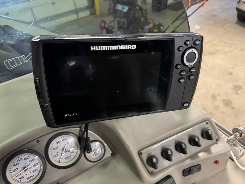 Slide: The Image of Humminbird Helix 7 fish finder on 2002 Lund 1775 Pro-V SE boat dashboard. - 10